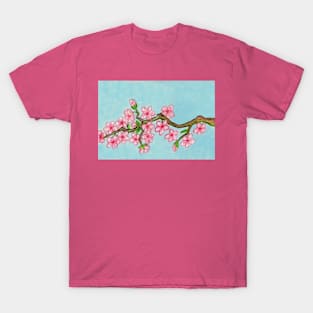 Branch with pink cherry flowers on blue T-Shirt